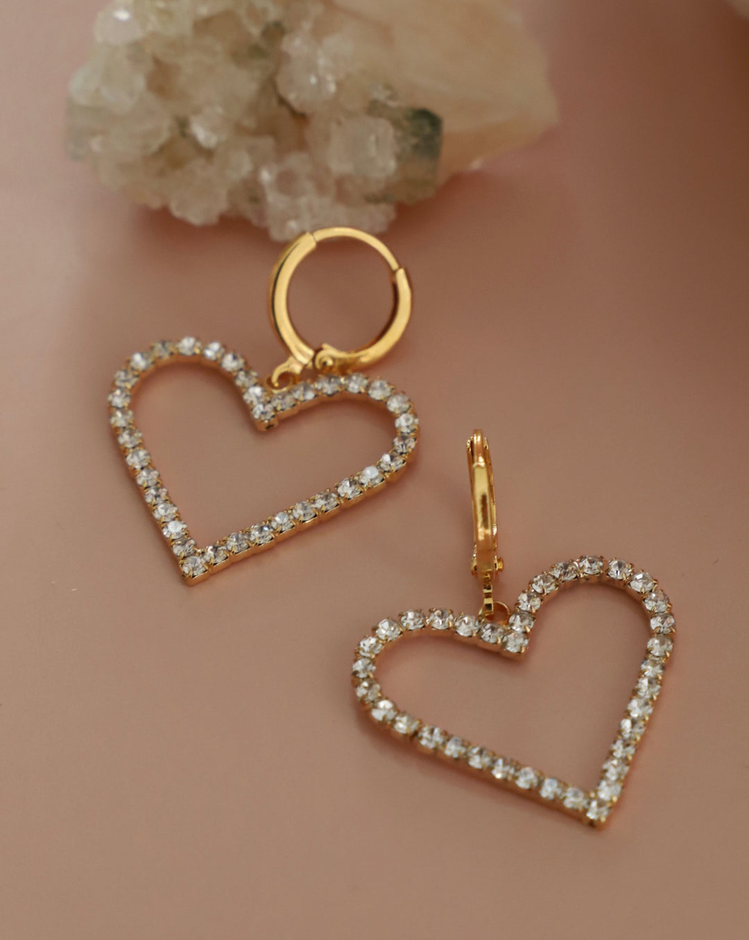 Heart shaped silhouette hoop earrings. 16kt gold plated. The perfect gift for her.